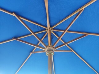 blue outdoor patio umbrella design with wooden frame © ozy24