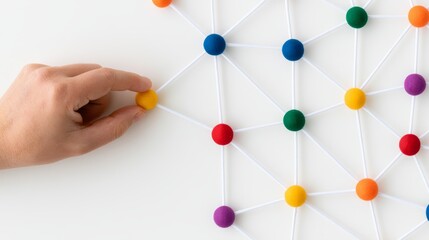 Obraz premium Hand Connecting Colorful Nodes in a Network Illustration Representing Freight Flexibility and Connections