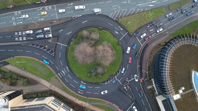 Aerial top-down view of traffic on a UK city roundabout