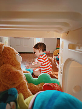 toddler boy playing with toys