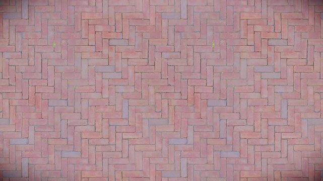 Classic herringbone brick pattern offers a warm, textured seamless loop background.
