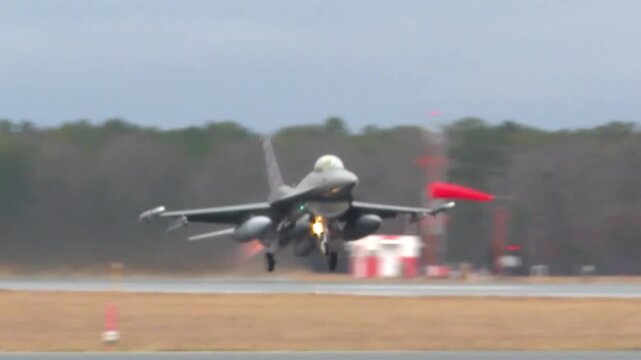 F-16 Fighting Falcons on Air Force Base Runway.