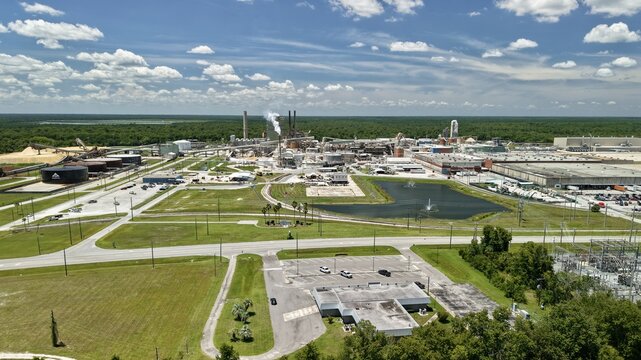 Aerial view of the Georgia-Pacific Palatka Operations paper mill with industrial smokestacks, storage tanks, and facilities near the St. Johns River in Palatka, Florida, United States.