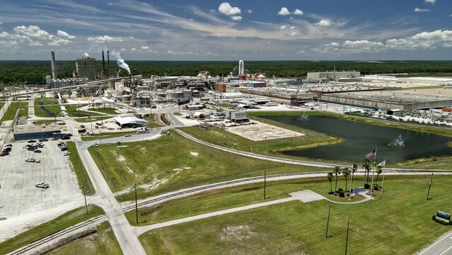 Aerial view of the Georgia-Pacific Palatka Operations industrial facility featuring manufacturing buildings, smokestacks, storage tanks, and a large pond in Palatka, Florida, United States.