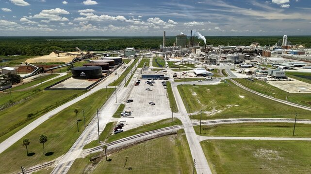 Aerial view of the Georgia-Pacific Palatka Operations paper mill facility featuring large storage tanks, industrial buildings, and surrounding green landscape in Palatka, Florida, United States.
