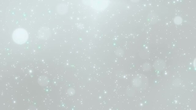 エレガントなグレージュの背景に光とキラキラの粒子が舞う動画素材 / Elegant greige background with glowing light rays and sparkling particles loop video