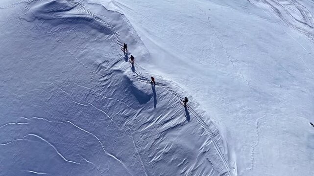 Aerial view of skiers on a snowy mountain slope in Nauders, Tyrol, Austria.