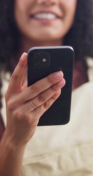 Hands, smile and woman at house with phone, social media and browsing website for funny video. Happy, female person and relax in home with mobile, streaming film and download ebook for weekend break