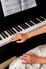 pianist female hands wearing jewelry playing piano © Елизавета Фильченко