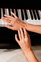 pianist female hands wearing jewelry playing piano © Елизавета Фильченко