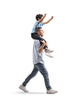 Man carrying a happy kid on shoulders and walking