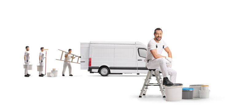 House painter sitting on a stepladder with paint buckets