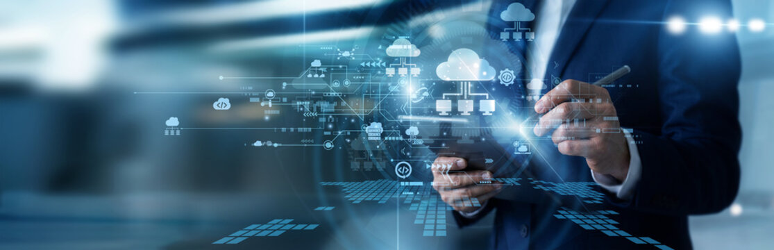 Systems architect working on tablet managing cloud computing networks, optimizing remote server database structures, monitoring data center storage loads, and deploying cloud computing tools.