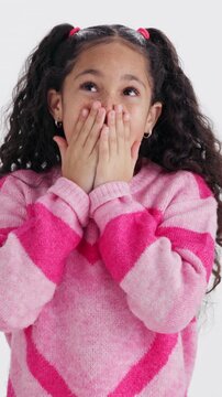 Omg, face and child in studio with shock, gift announcement and surprised at good news. Unexpected, portrait and girl on white background with present reveal, wow reaction and amaze at bonus prize.