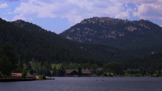 Summer Evergreen Lake paddleboarding canoe kayak boats water sports aerial drone Evergreen Colorado foothills Denver Golf Course Front Range Rocky Mountain sunny cloudy morning haze focus static