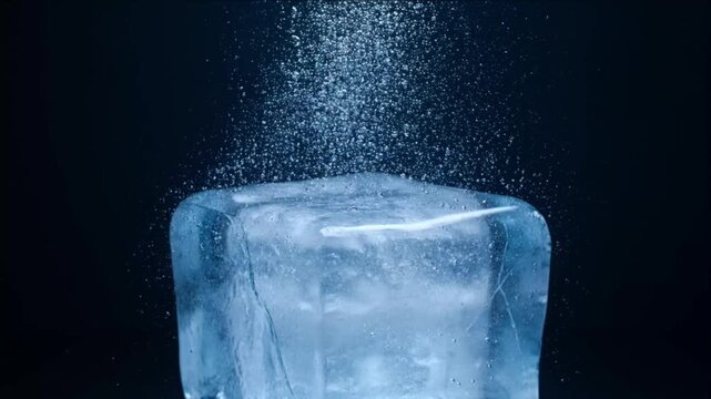 Sparkling ice water background with cube droplet splash and cold frost texture on dark blue scene creating fresh minimal abstract design and dramatic motion splash frozen cube background