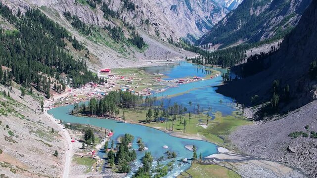 Mahodand Lake winds through Upper Ushu Valley with turquoise water, forest, and river in Khyber Pakhtunkhwa, Pakistan