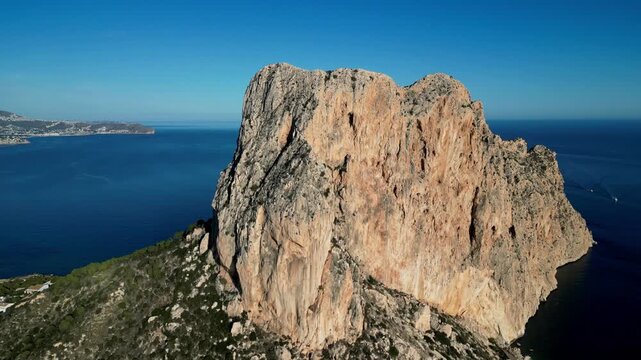 Aerial view of the Penyal d'Ifac limestone rock formation rising above the Mediterranean Sea in Calp, Valencian Community, Spain.