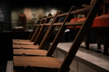 Row Wooden Chairs Museum Exhibit Display © LightItUp