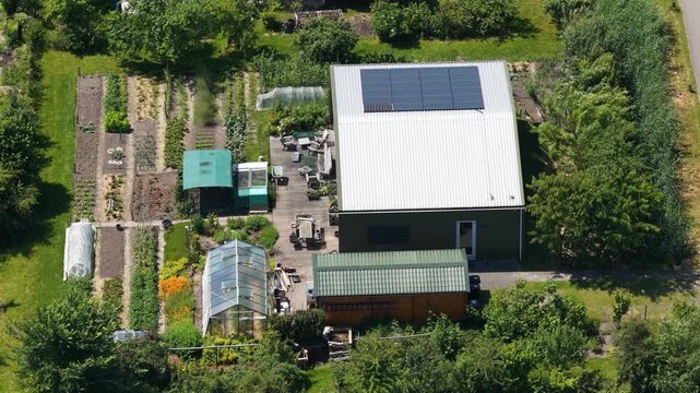 Aerial view of an ecovillage in Almere, showing sustainable housing, urban farming, solar panels, self sufficient living and renewable energy in the Netherlands.