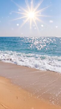 Ocean waves washing onto sandy shore under bright sun. Vertical video with tilting camera movement.