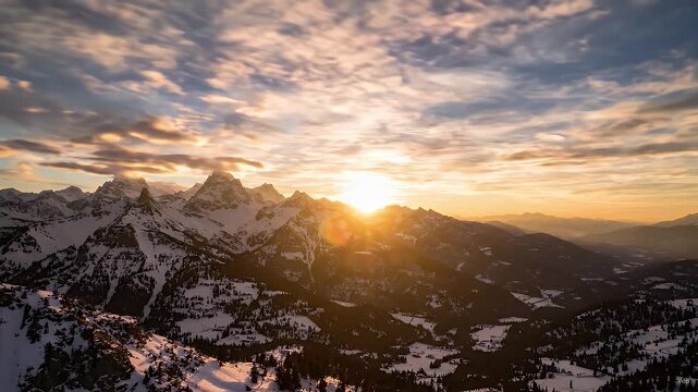 Vibrant Sunrise Over Snow-Covered Mountain Ranges