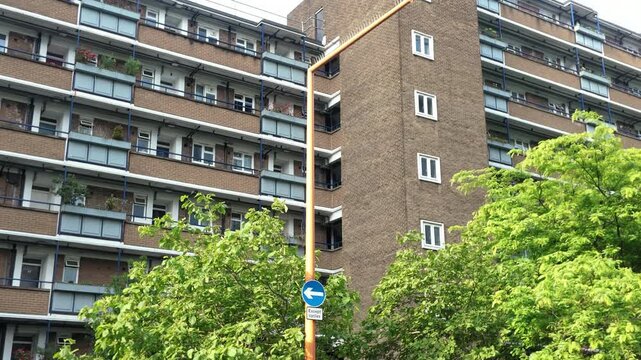 Brutalist style brick apartment building in an urban setting