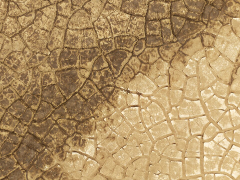 Aerial view of cracked dry earth patterns of the Skeleton Coast desert terrain in the Kunene Region, Namibia.