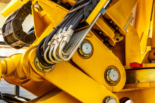  Induastrial machine pattern with yellow tolls and steel cable elements of industry production line on a factory. Manufacturing concept background for workplace desing .