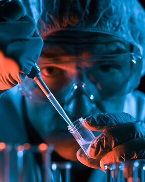 Advanced Science Lab: Scientist Conducting Experiment with Test Tube and Pipette in a Research Facility