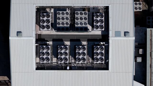 Aerial view of industrial cooling fans on a data center rooftop in Redditch, England, United Kingdom.
