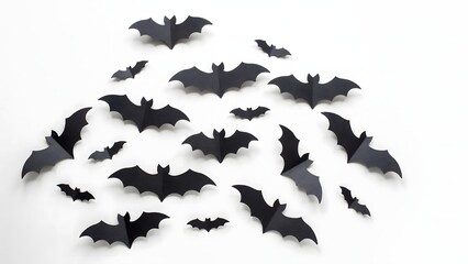 Fototapeta premium Black paper bats for Halloween decoration. Flying bat silhouettes for spooky party decor.