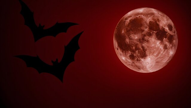 Bats flying against a full moon. Spooky Halloween night background with red lunar sky.