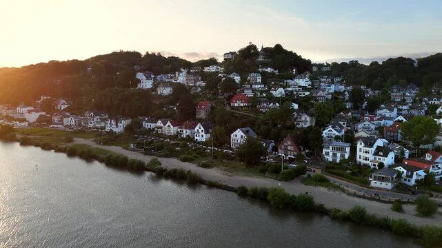 Aerial view of Treppenviertel Blankenese with historic houses and lush greenery along the Elbe river in Hamburg, Hamburg, Germany.