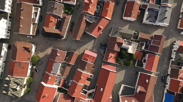Aerial view of red-roofed buildings and streets in the town center of Mandal, Agder, Norway.