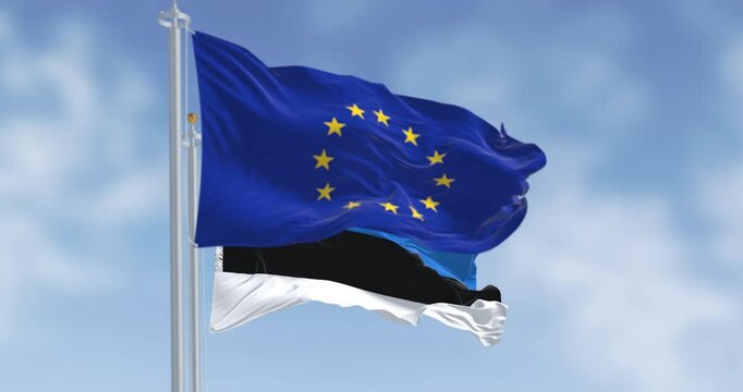 The flags of Estonia and the European Union waving together on a clear day
