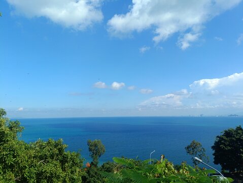 Blue sea and sky view with green trees from Danang Vietnam