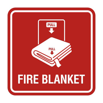 Fire blanket sign displays instructions for emergency use to suppress flames in a professional workspace.