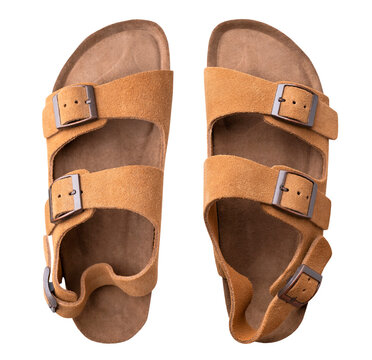 Leather summer sandals with cork soles isolated on white background, top view shows paired footwear with adjustable straps and buckles. With clipping path. Mockup. Sandals suit fashion catalogs