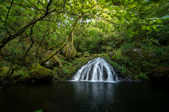 Idyllic waterfalls on the River Edo in Castro Caldelas, Ourense, Galicia, Spain