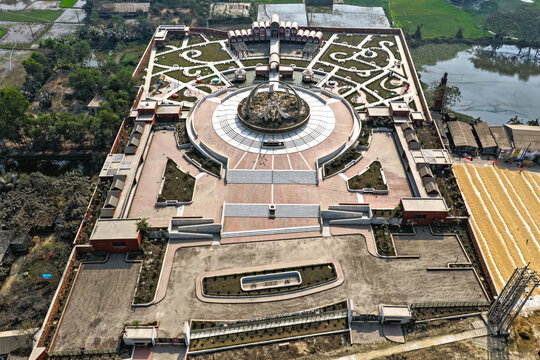 Aerial view of the Ashuganj Upazila Parishad complex with a symmetrical garden layout, central circular plaza, and brick pathways in Ashuganj Upazila, Chittagong Division, Bangladesh.