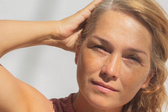 Calm Woman with Freckles and Salt and Pepper Hair