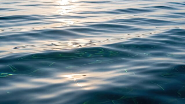 Close up of sparkling blue ocean water ripples.
