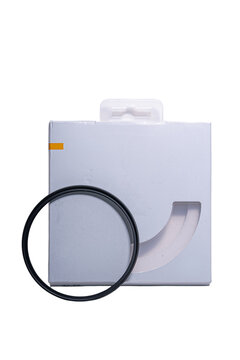 Isolated professional product shot of camera lens filter with clean blank white packaging box