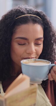 Coffee, happy and woman with book in home with relax, calm or satisfaction on weekend break. Novel, unwind and person drinking warm beverage for peace, positive attitude or reading story in house.
