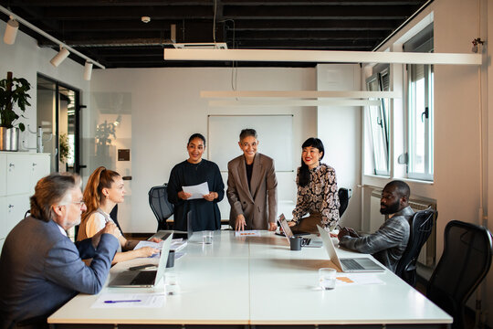 Diverse business team meeting in modern office conference room