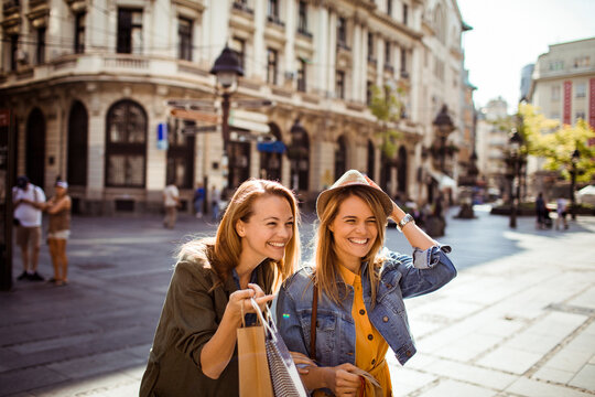 Two young women shopping in historic european city