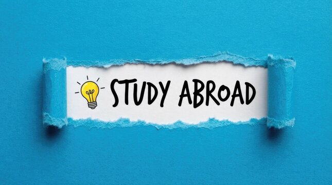 A torn blue paper revealing the text study abroad with a lightbulb icon to celebrate international literacy day and the importance of global education