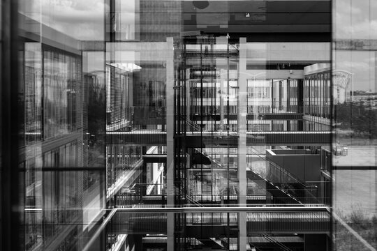 Abstract window reflections in morden office building in black and white.
