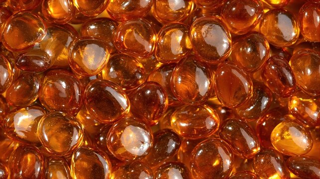 Deep caramel glass stones piled into a rich tactile pattern, close macro study of translucent rounded shapes